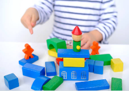 Colorful assortment of toys and baby essentials in a cheerful nursery.